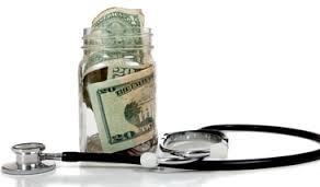 Jar of money and a stethoscope
