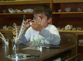 Boy with magnifying glass